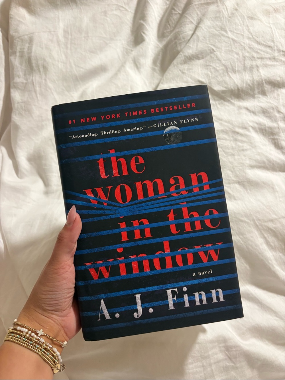 The Woman in the Window by A. J. Finn - Dark Blue & Red Hardcover